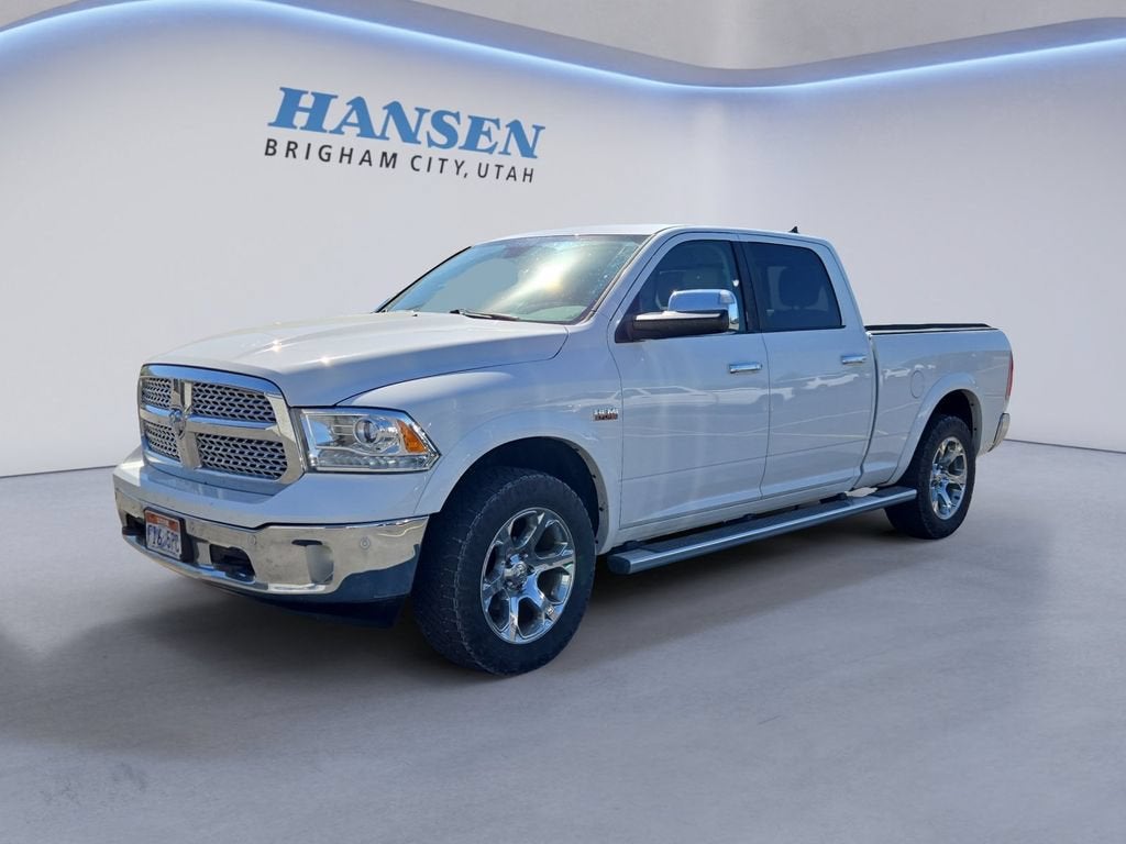 2014 RAM 1500 Laramie in White — front three-quarter view